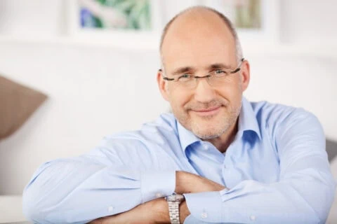 Close,portrait,of,smiling,man,relaxing,at,home