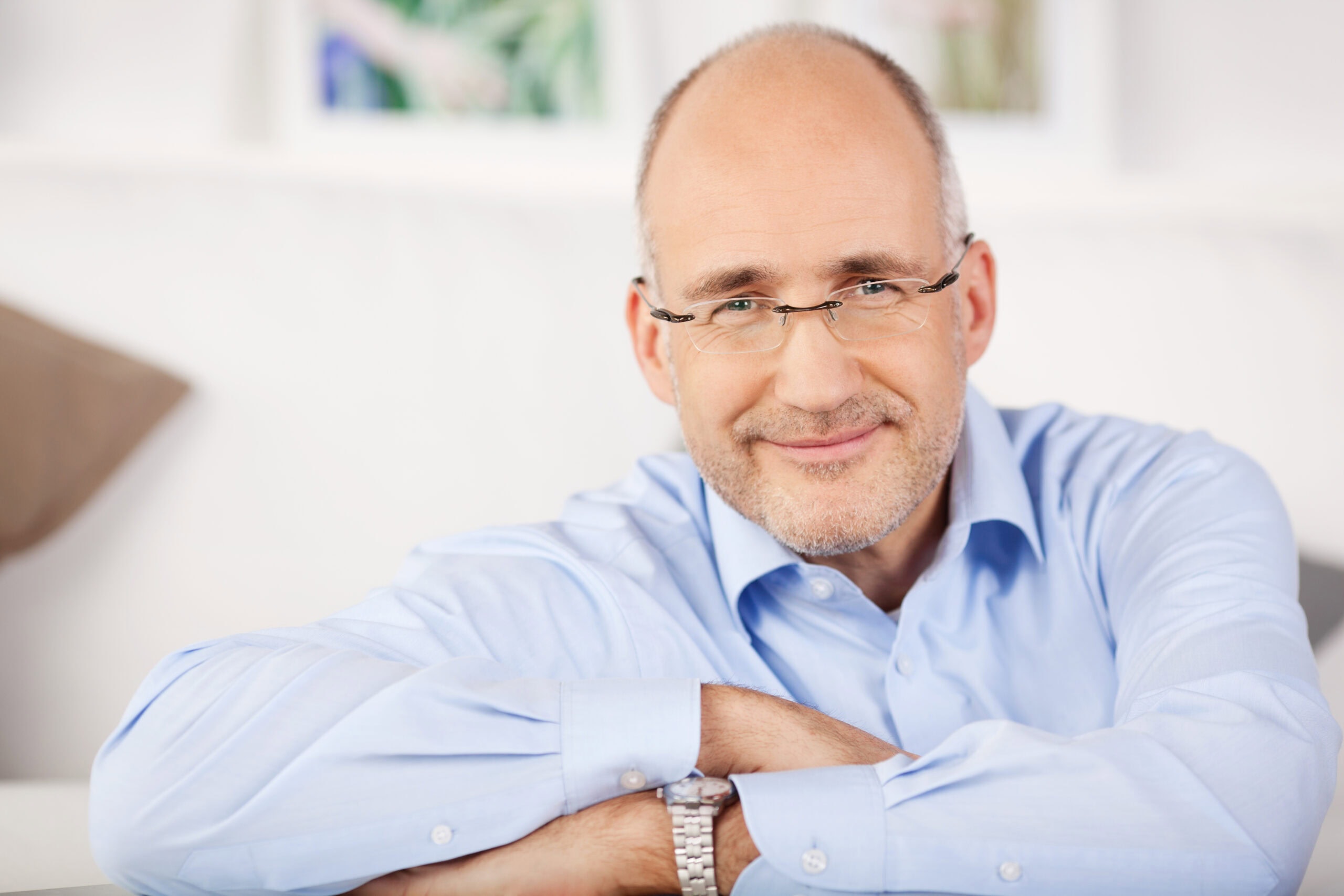 Close,portrait,of,smiling,man,relaxing,at,home